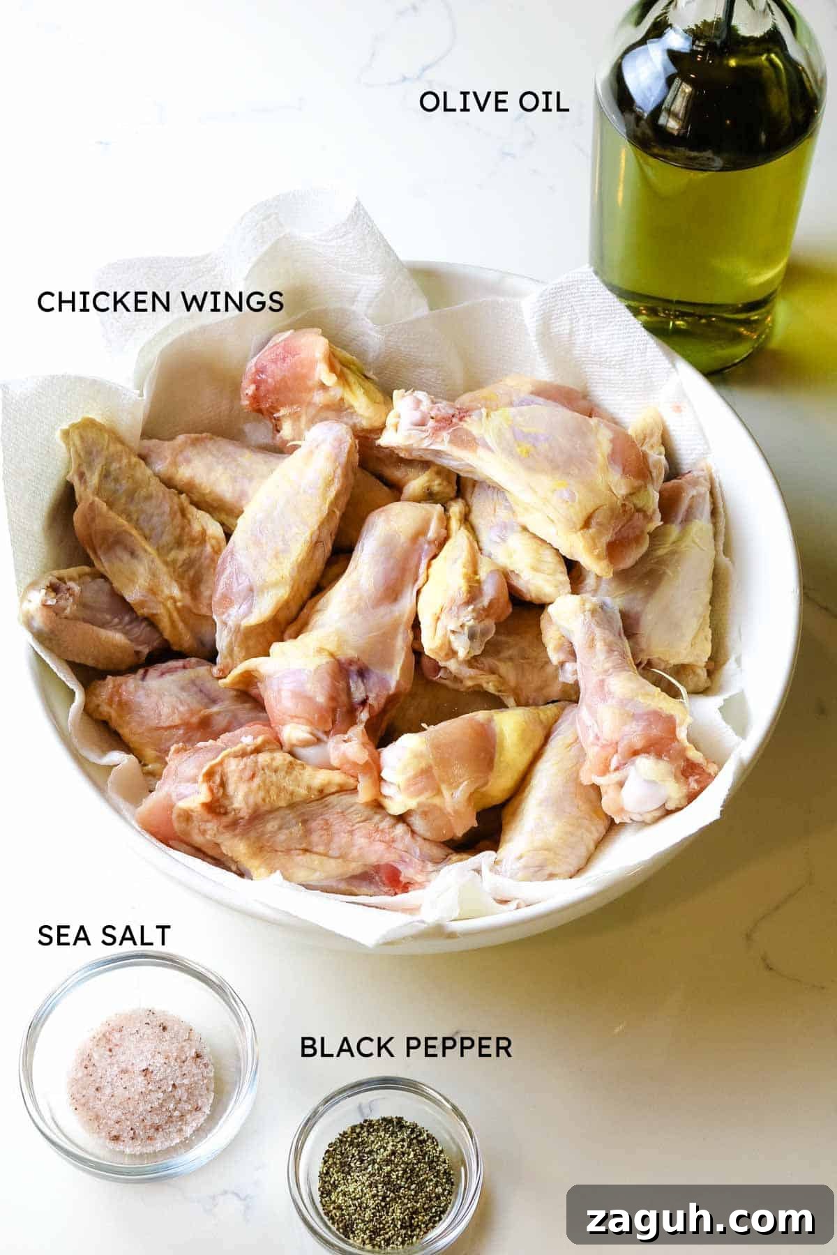 Crispy Baked Salt-and-Pepper Chicken Wings Recipe 3 ingredient shot of chicken wings, salt, pepper, and olive oil.