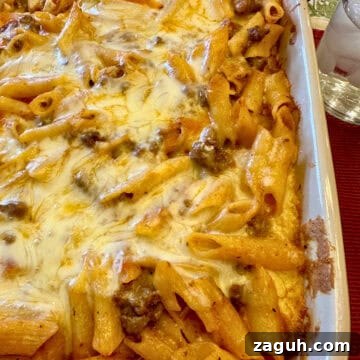 Quick No-Fuss Lasagna Recipe for Busy Weeknights 20 Layered pasta with beef, sauce and melted cheese in a baking dish.