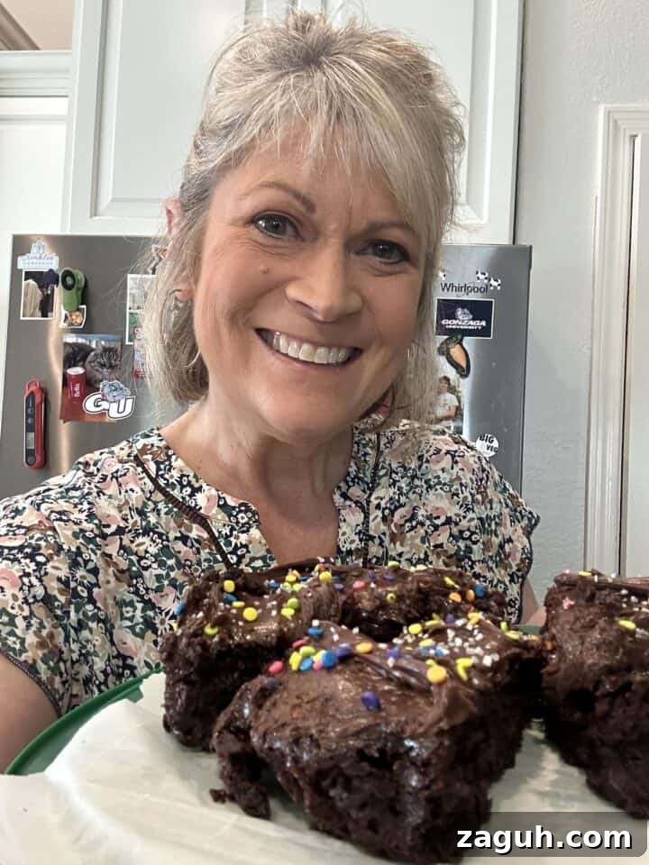 Quick No-Fuss Lasagna Recipe for Busy Weeknights 3 Melinda in the kitchen holding a plate of chocolate cake slices.