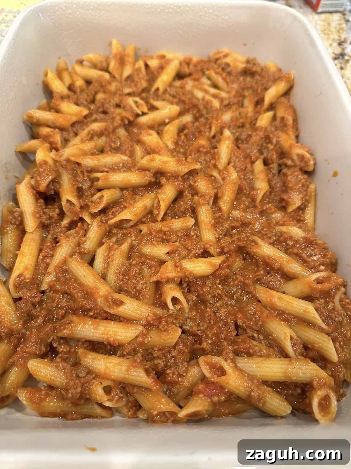 Quick No-Fuss Lasagna Recipe for Busy Weeknights 8 Pasta, sauce and meat in a baking dish.