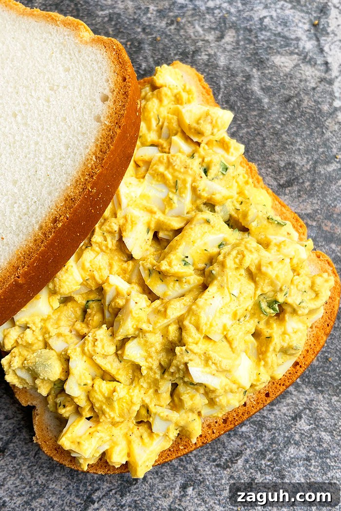 One-Pan Egg Salad Sandwich Recipe for Quick Lunch 4 Best Sandwich With Creamy Egg Salad on Rustic Gray Background- Overhead Shot