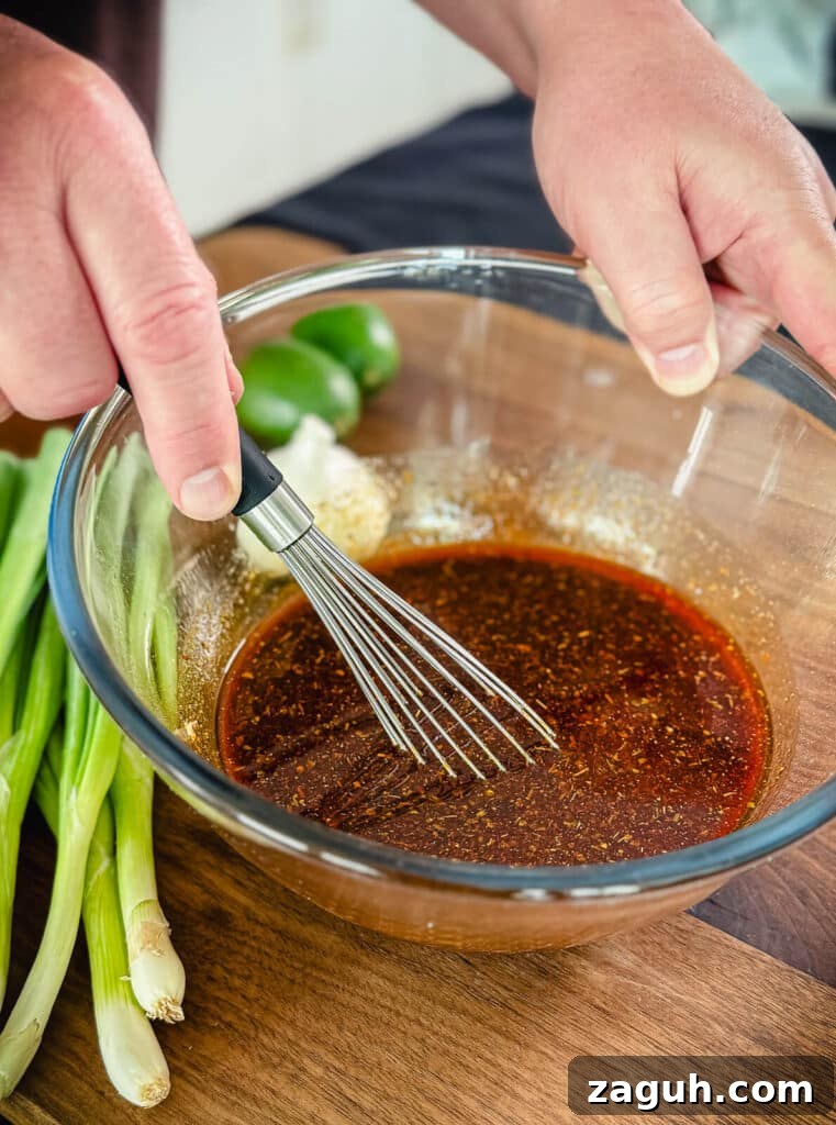Peruvian-Style Chicken Breast Skewers with Aji Marinade 9 whisk mixing up Peruvian chicken marinade