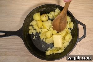 Rustic Buttermilk Mashed Potatoes Without a Masher 11 Adding the butter to the potatoes