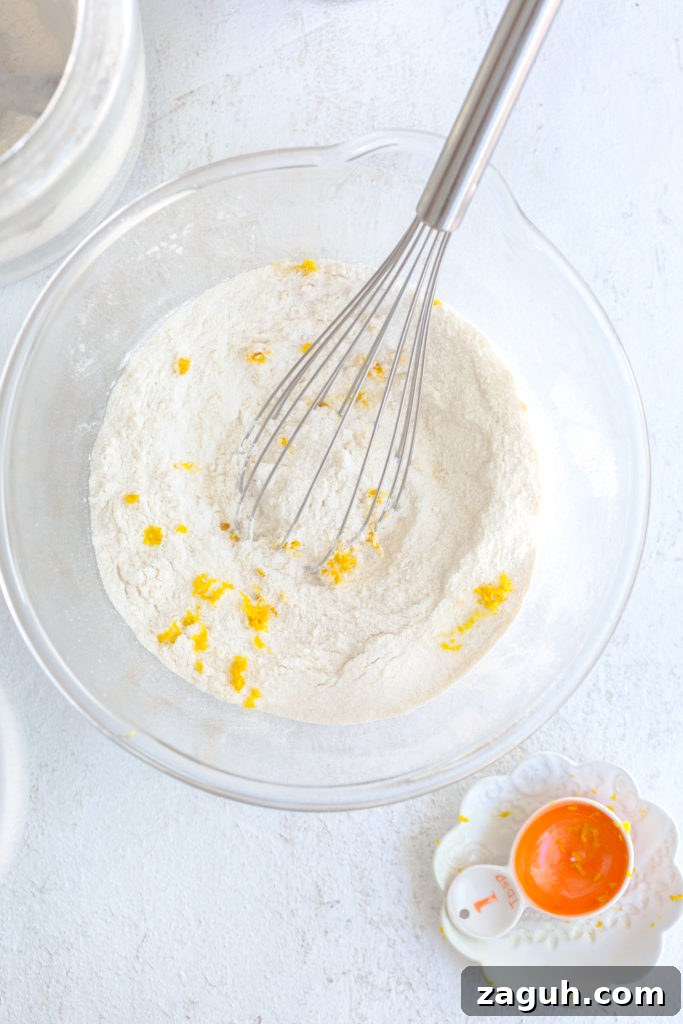 Adding orange zest to Orange Aperitivo Olive Oil Cake