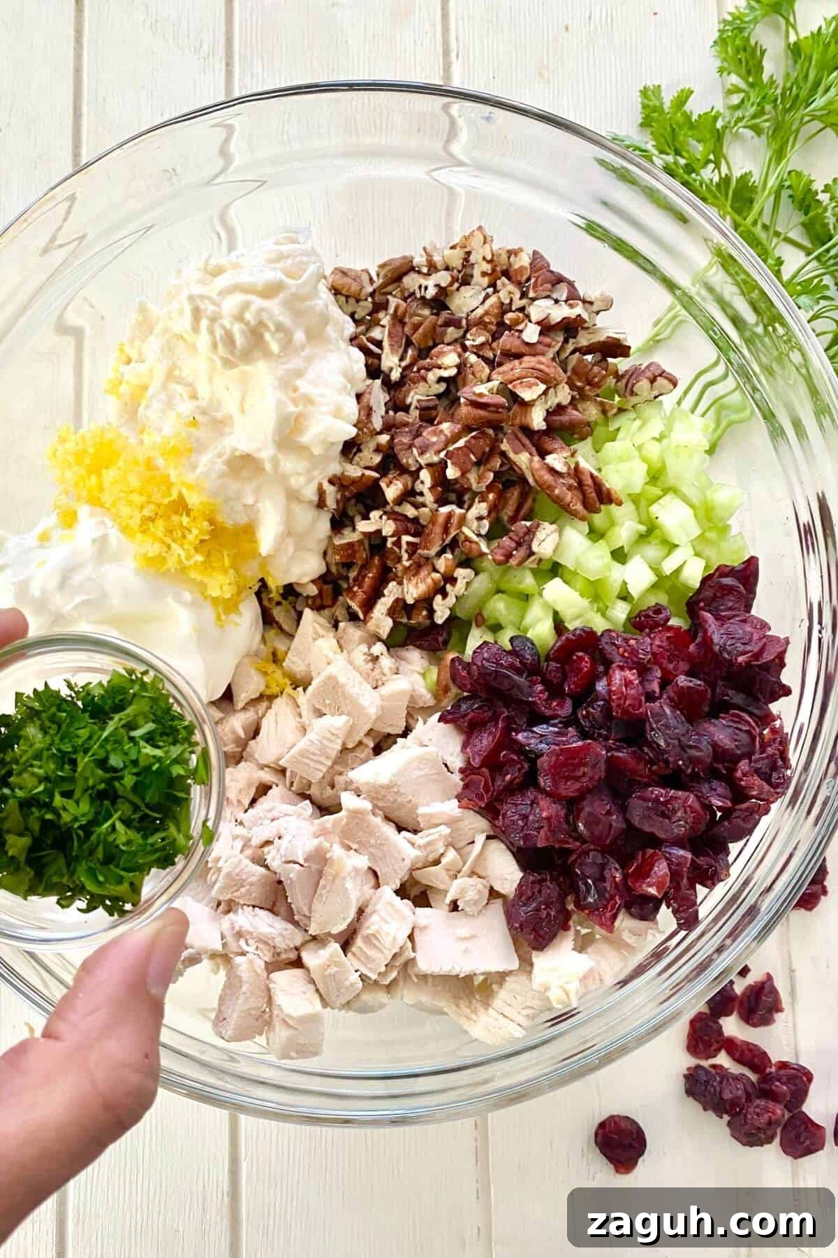 Cranberry Chicken Salad with Toasted Pecans Recipe 4 glass bowl with ingredients for cranberry chicken salad.