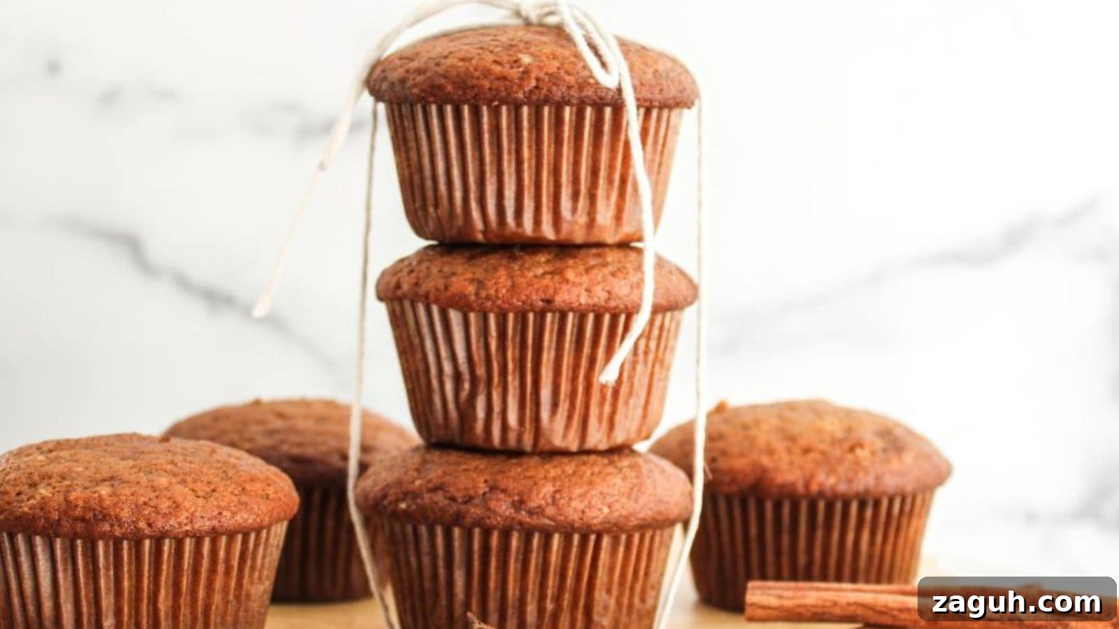 A stack of pumpkin spiced muffins on a plate.