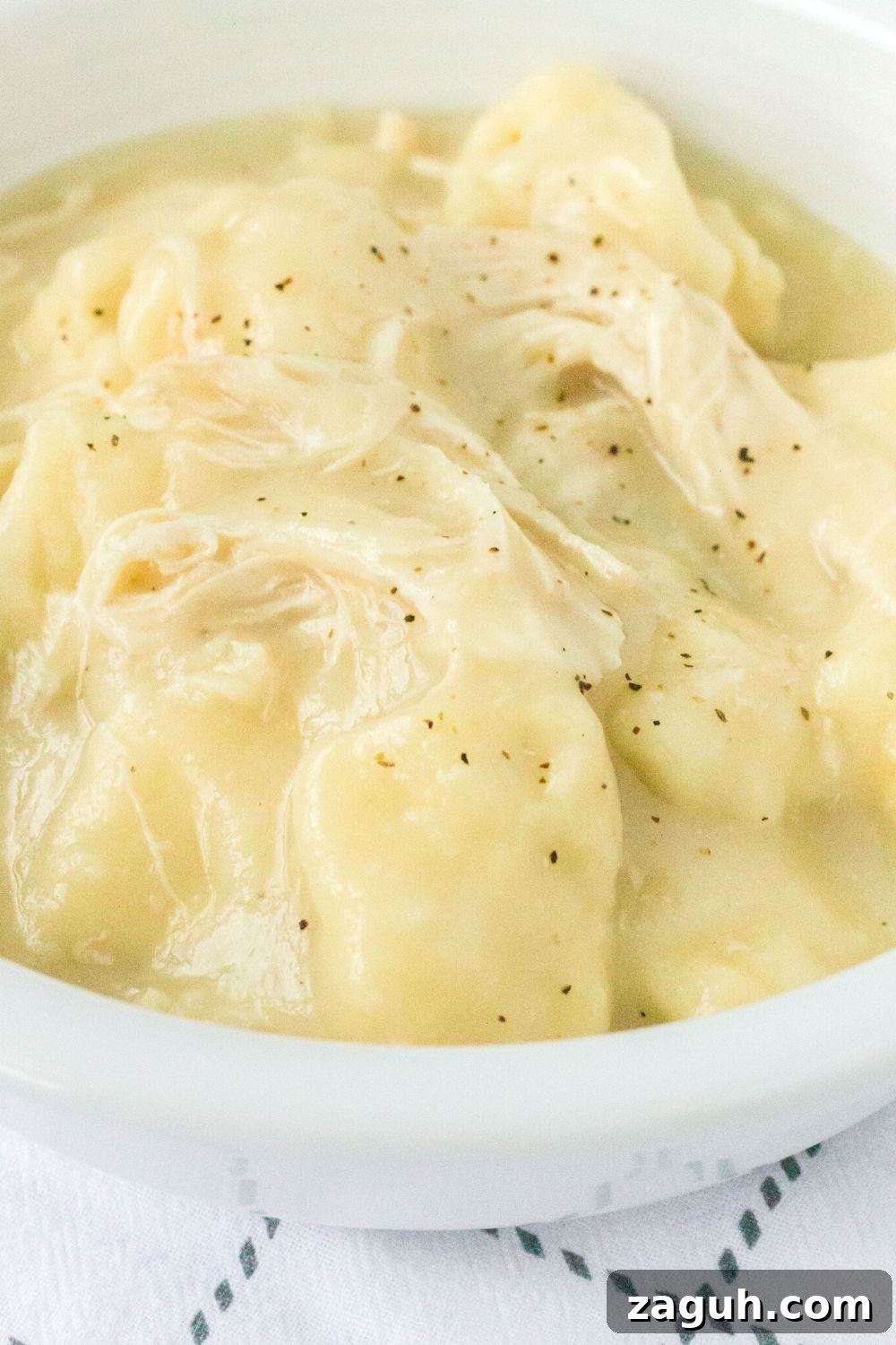 Slow-Cooker Chicken and Dumplings Recipe for Comforting Dinners 4 close-up view of tender chicken and dumplings made in the Crock Pot