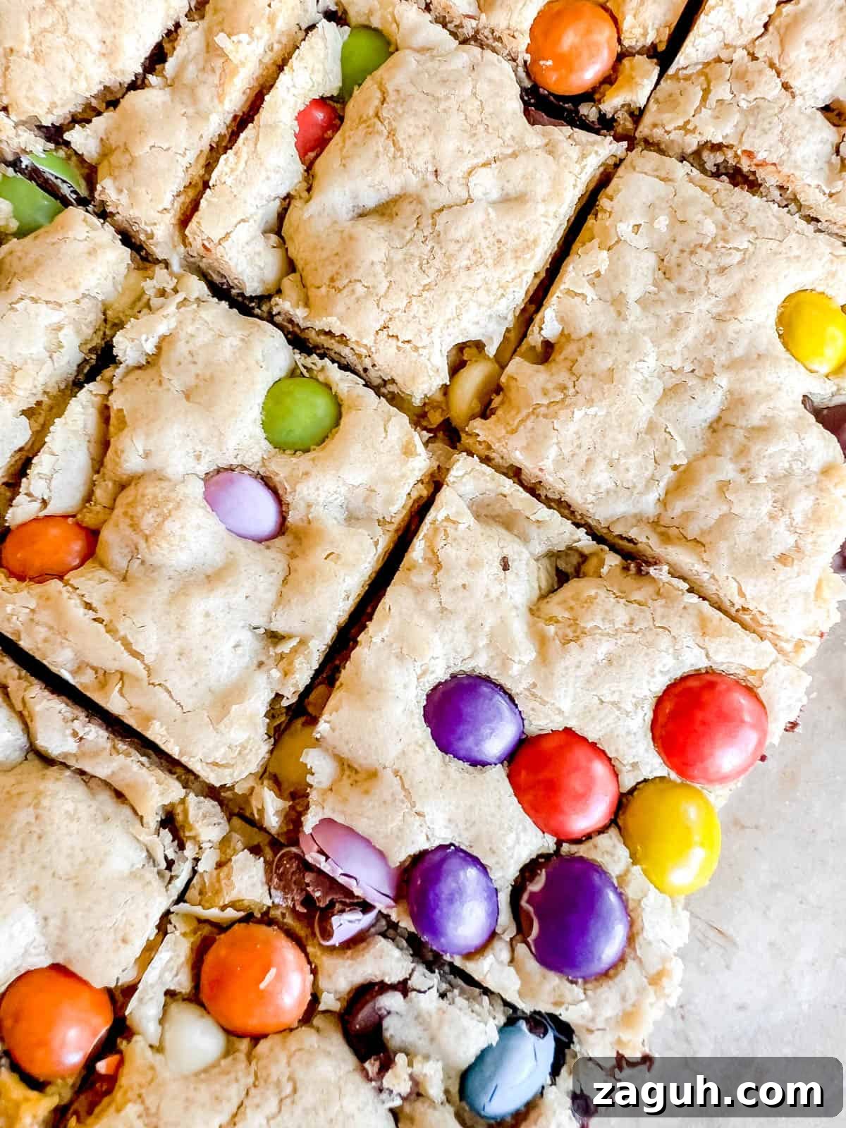 Gluten-Free Chocolate Chip Cookie Bars (Dairy-Free) 11 Gooey chocolate chip cookie bars with chocolate candies inside.