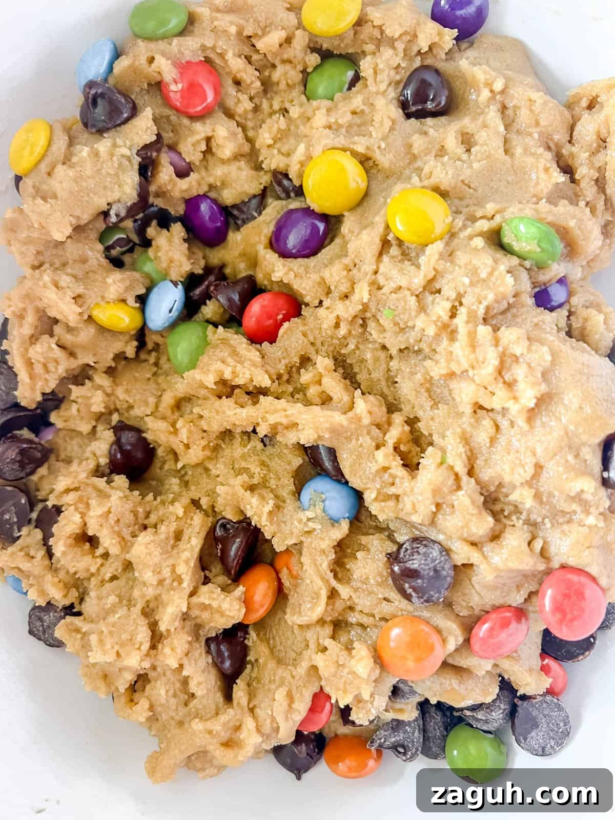 Gluten-Free Chocolate Chip Cookie Bars (Dairy-Free) 7 Raw cookie bar dough with chocolate chips inside.