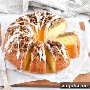 Sticky Pecan Upside-Down Cake Recipe for Moist, Caramelized Dessert 12 bundt cake sliced up on a wooden board.