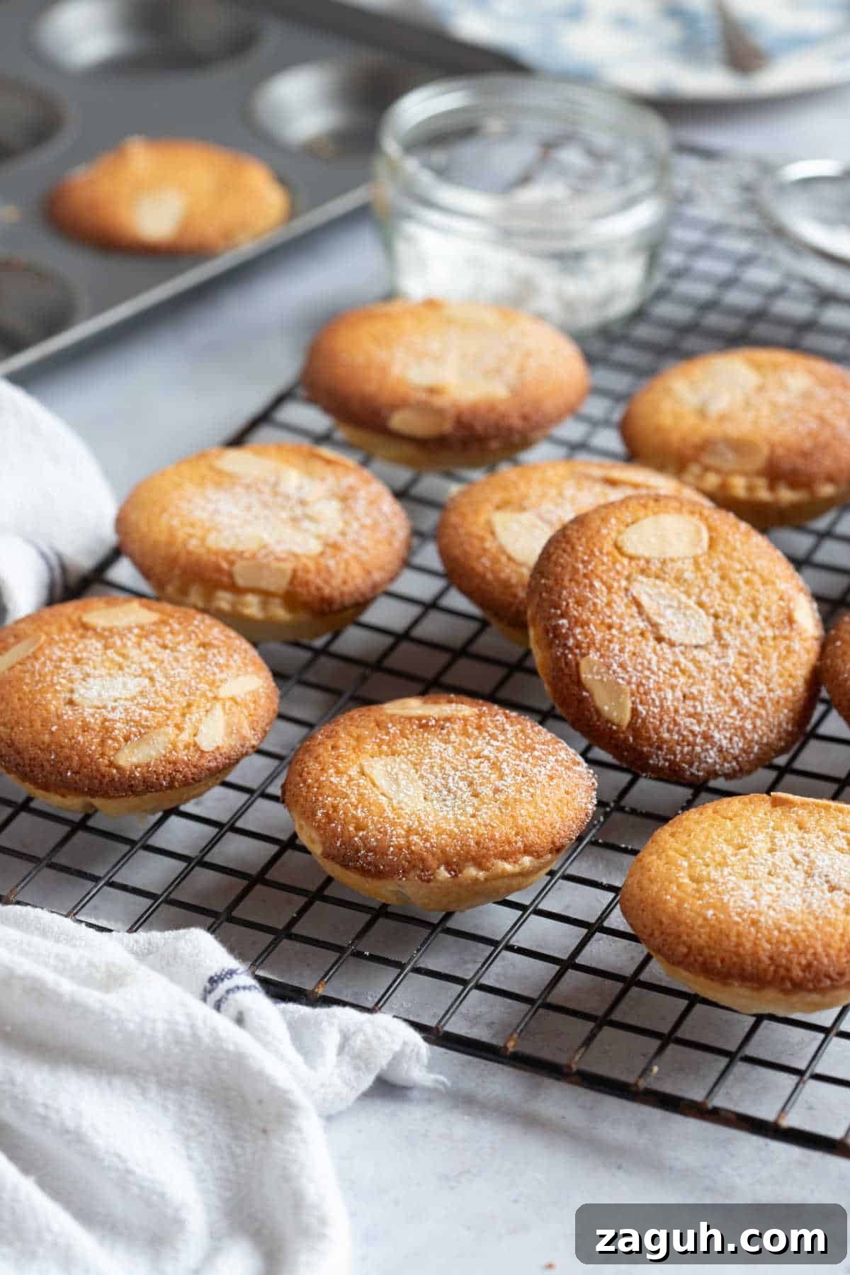 Frangipane Mince Pies Recipe: Classic Almond-Filled Holiday Pastries 6 Almond topped mince pies on a wire rack.