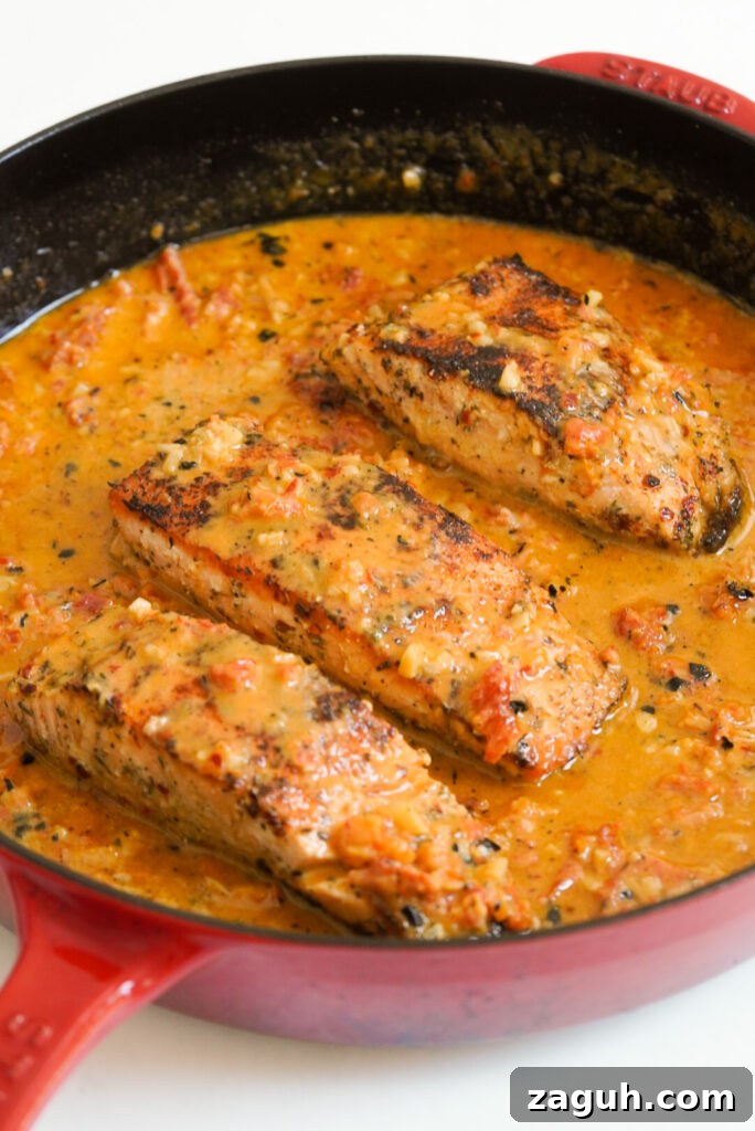 Marry Me Salmon Recipe: Creamy Garlic Butter Salmon You'll Love 11 3 pieces of marry me salmon in a skillet.