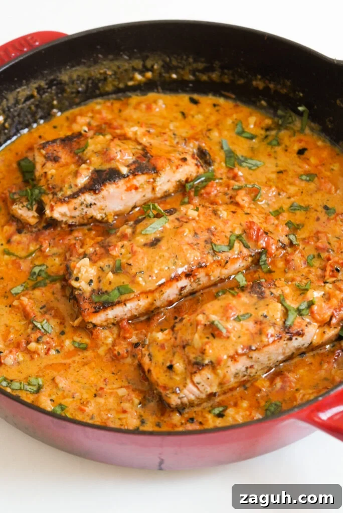 Marry Me Salmon Recipe: Creamy Garlic Butter Salmon You'll Love 3 marry me salmon skillet dinner in a red cast iron skillet.