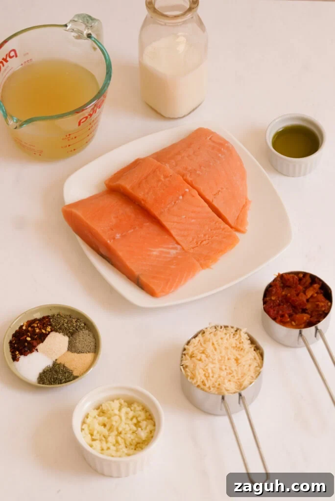 Marry Me Salmon Recipe: Creamy Garlic Butter Salmon You'll Love 4 ingredients to make marry me salmon measured out on a white table.