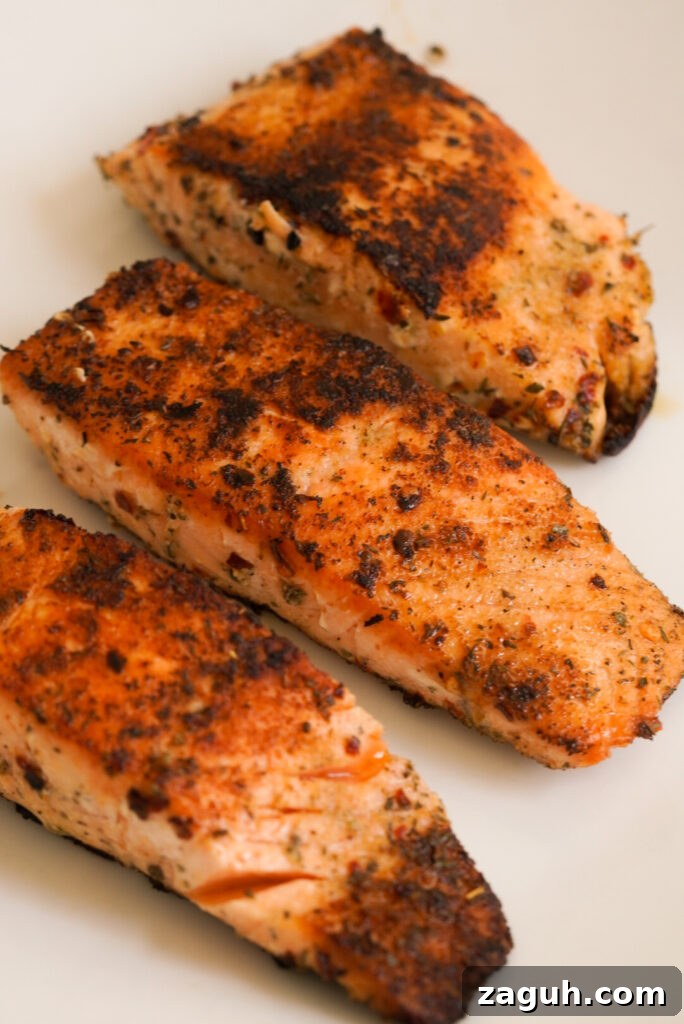 Marry Me Salmon Recipe: Creamy Garlic Butter Salmon You'll Love 7 3 seared salmon fillets that are crispy brown.