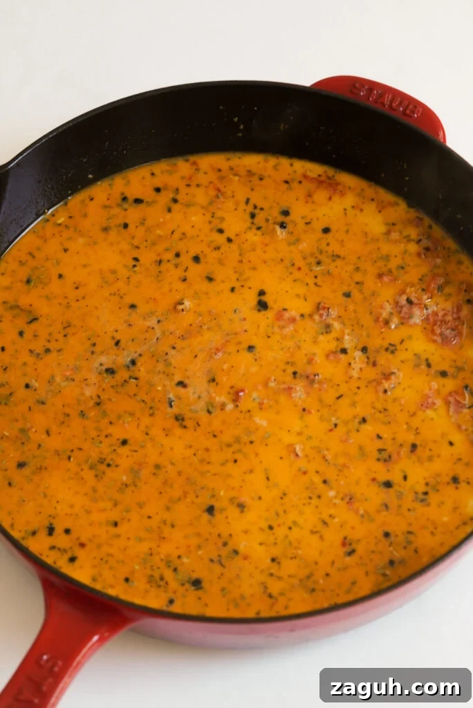 Marry Me Salmon Recipe: Creamy Garlic Butter Salmon You'll Love 9 marry me salmon sauce in the skillet before simmering to thicken.