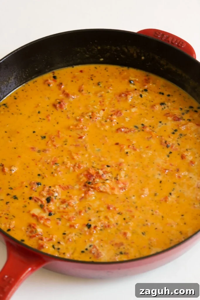 Marry Me Salmon Recipe: Creamy Garlic Butter Salmon You'll Love 10 marry me salmon sauce in the skillet after thickening.
