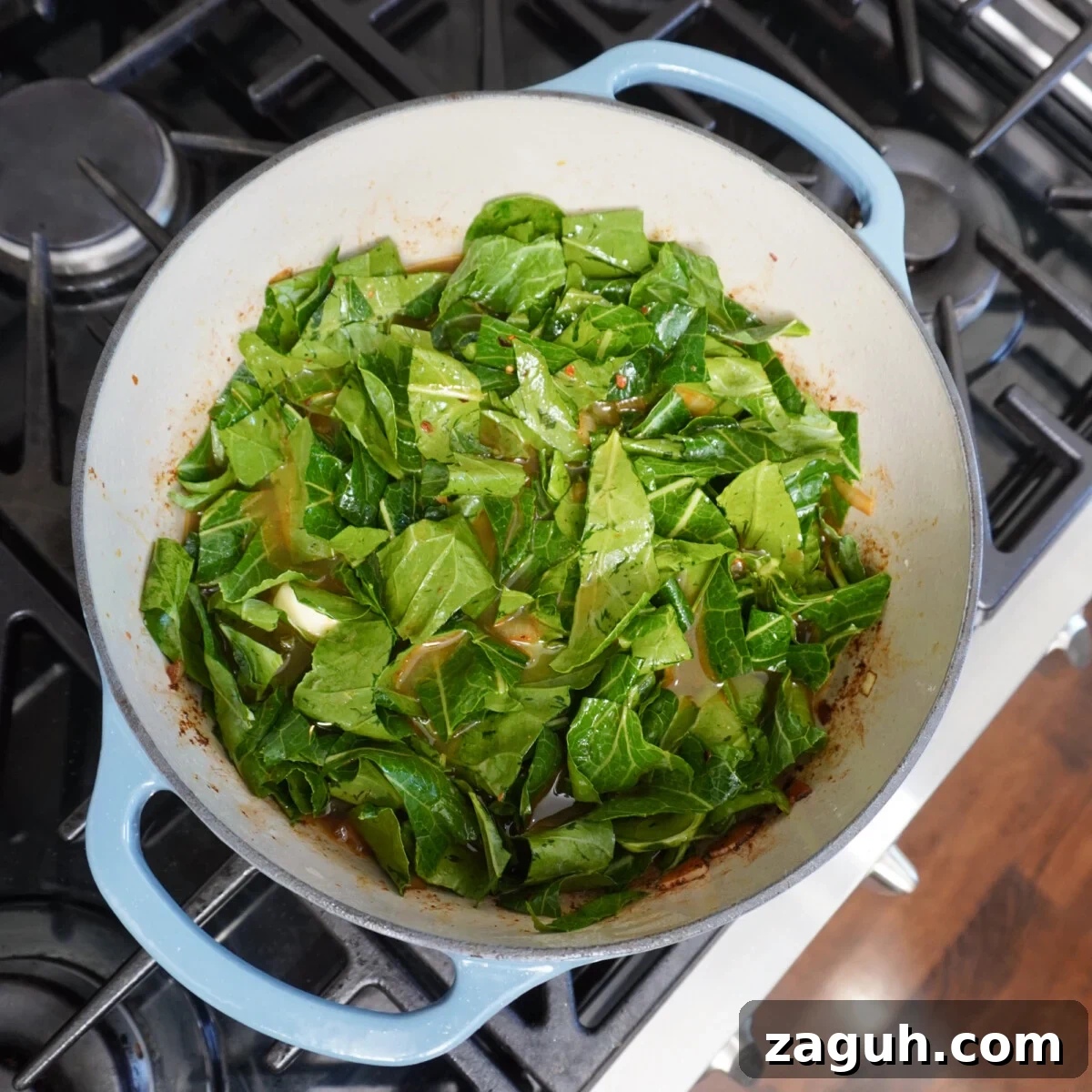 Savory Sausage and Slow-Simmered Collard Greens Recipe 8 collard greens in dutch oven.