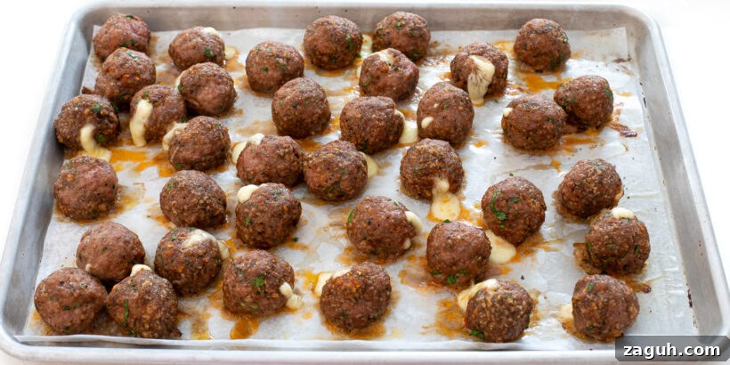 baked turkey meatballs on baking sheet