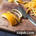 Slicing orange peel to make Candied Orange Peel