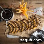 Freshly made Candied Orange Peel being drizzled with melted dark chocolate