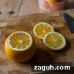 Cutting the oranges to make Candied Orange Peel