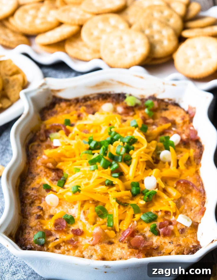 Crack Dip topped with shredded cheese and green onions