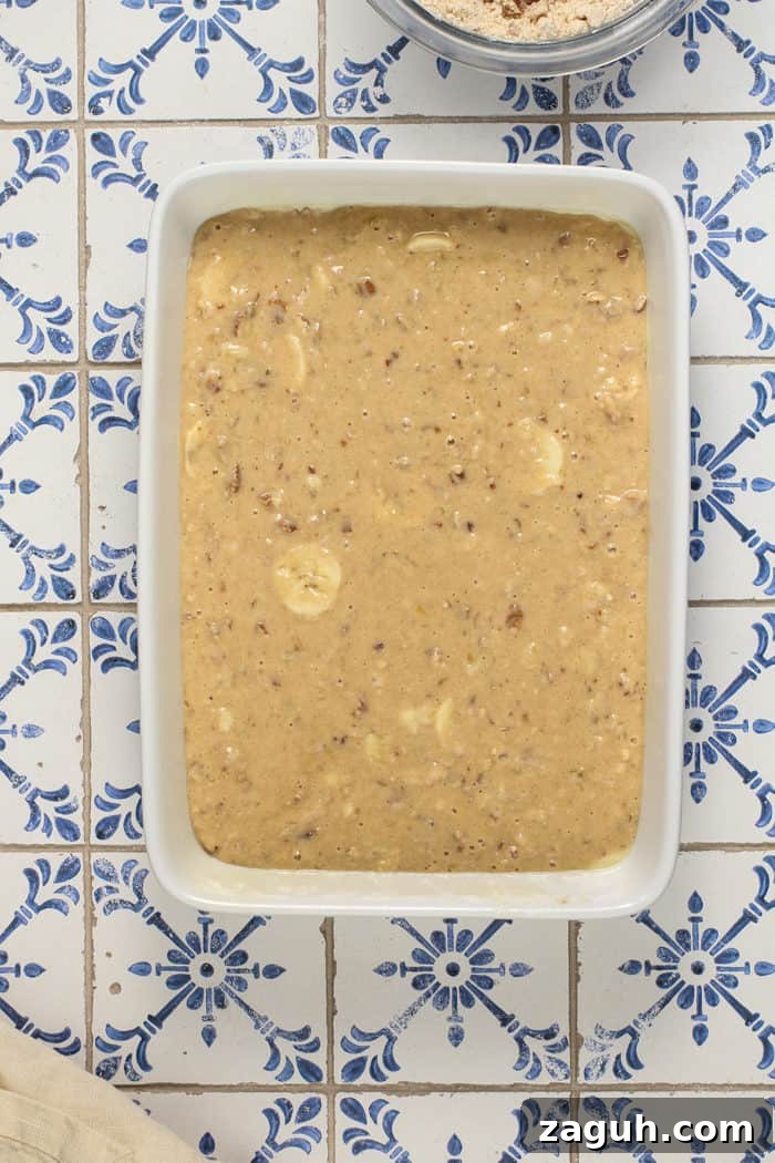 Make-Ahead Banana Coffee Cake Recipe for Perfect Morning Baking 5 Batter for banana coffee cake spread into a white baking dish