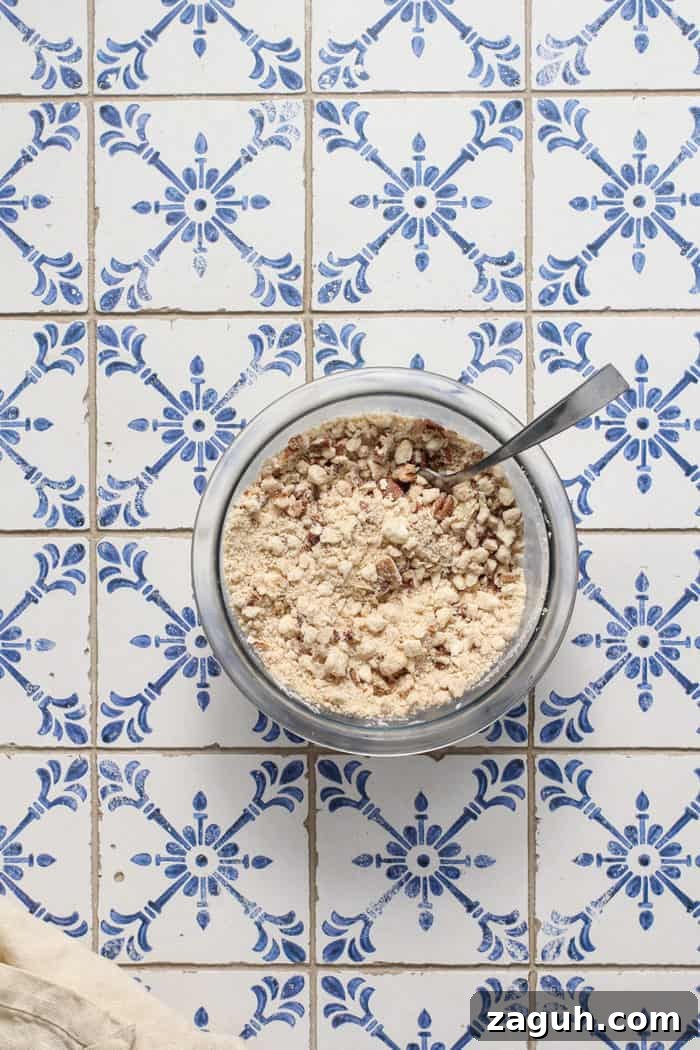 Make-Ahead Banana Coffee Cake Recipe for Perfect Morning Baking 6 Streusel topping for banana coffee cake being stirred together in a small glass mixing bowl