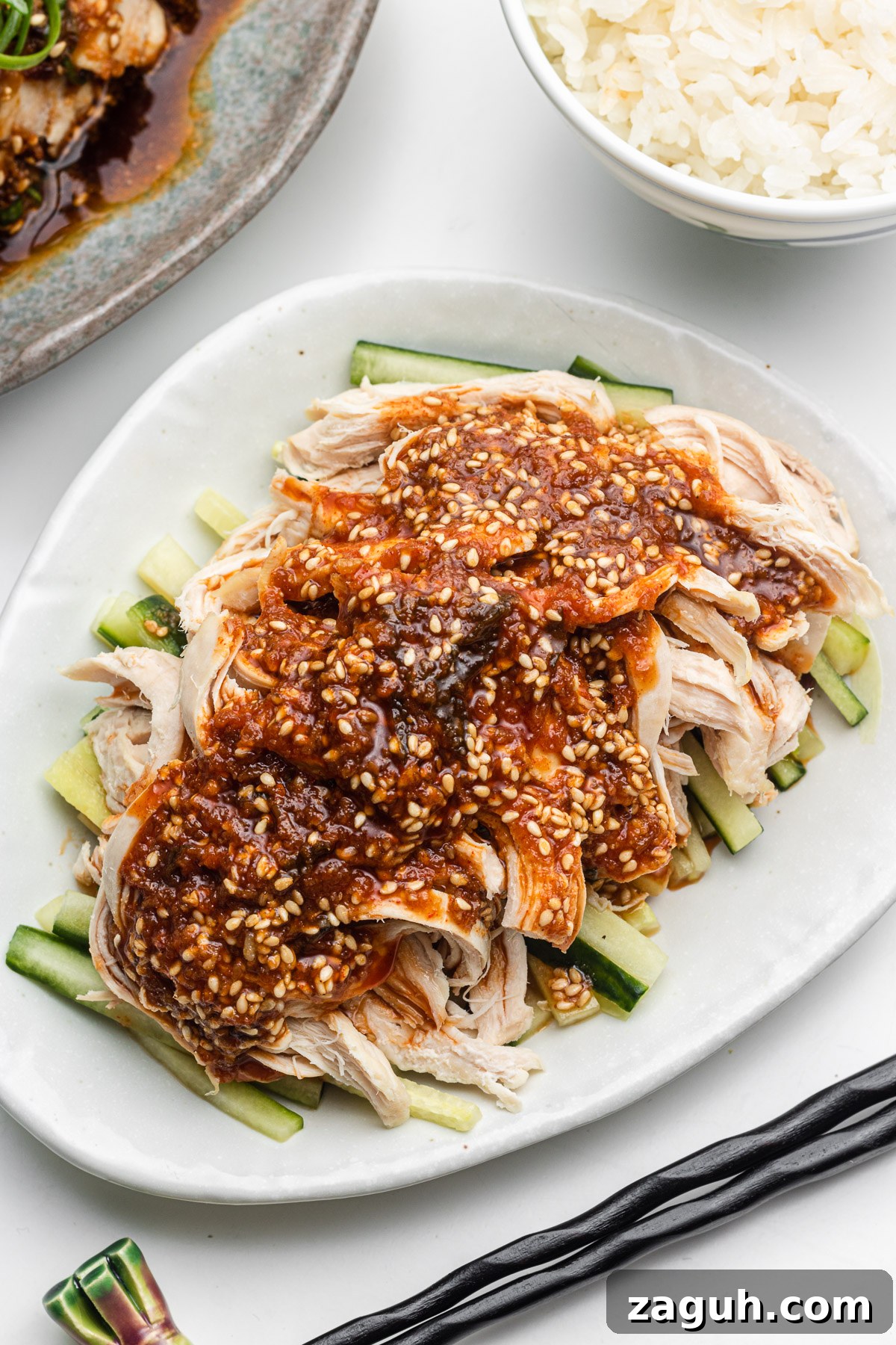 Rice Cooker Yodare Chicken with Steamed Rice: Simple One-Pot Meal 5 chicken breast with miso chili oil sauce over cucumbers