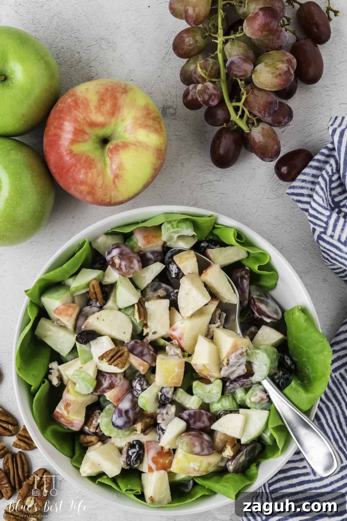 Lightened Waldorf Salad with Creamy Greek Yogurt Dressing 2 A top shot of skinny Waldorf salad in a serving bowl.
