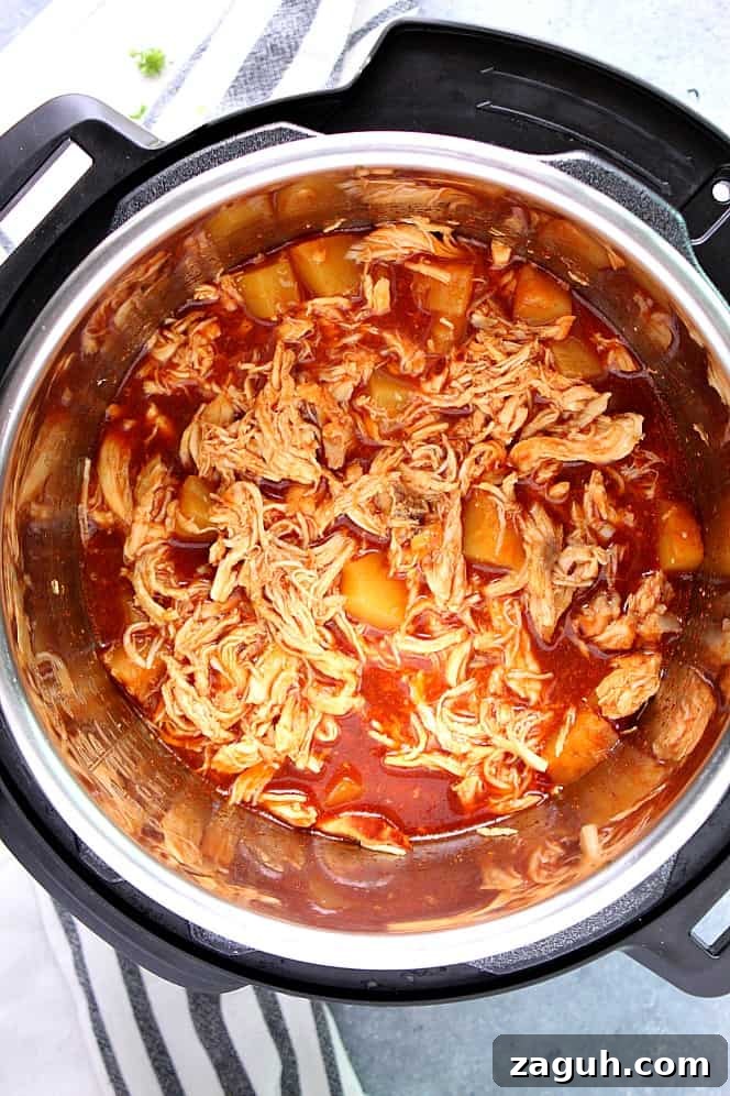 Instant Pot Hawaiian BBQ Chicken Recipe - pulled chicken with sweet pineapple BBQ sauce cooked in pressure cooker. Pulled BBQ chicken with pineapple in Instant Pot digital pressure cooker.