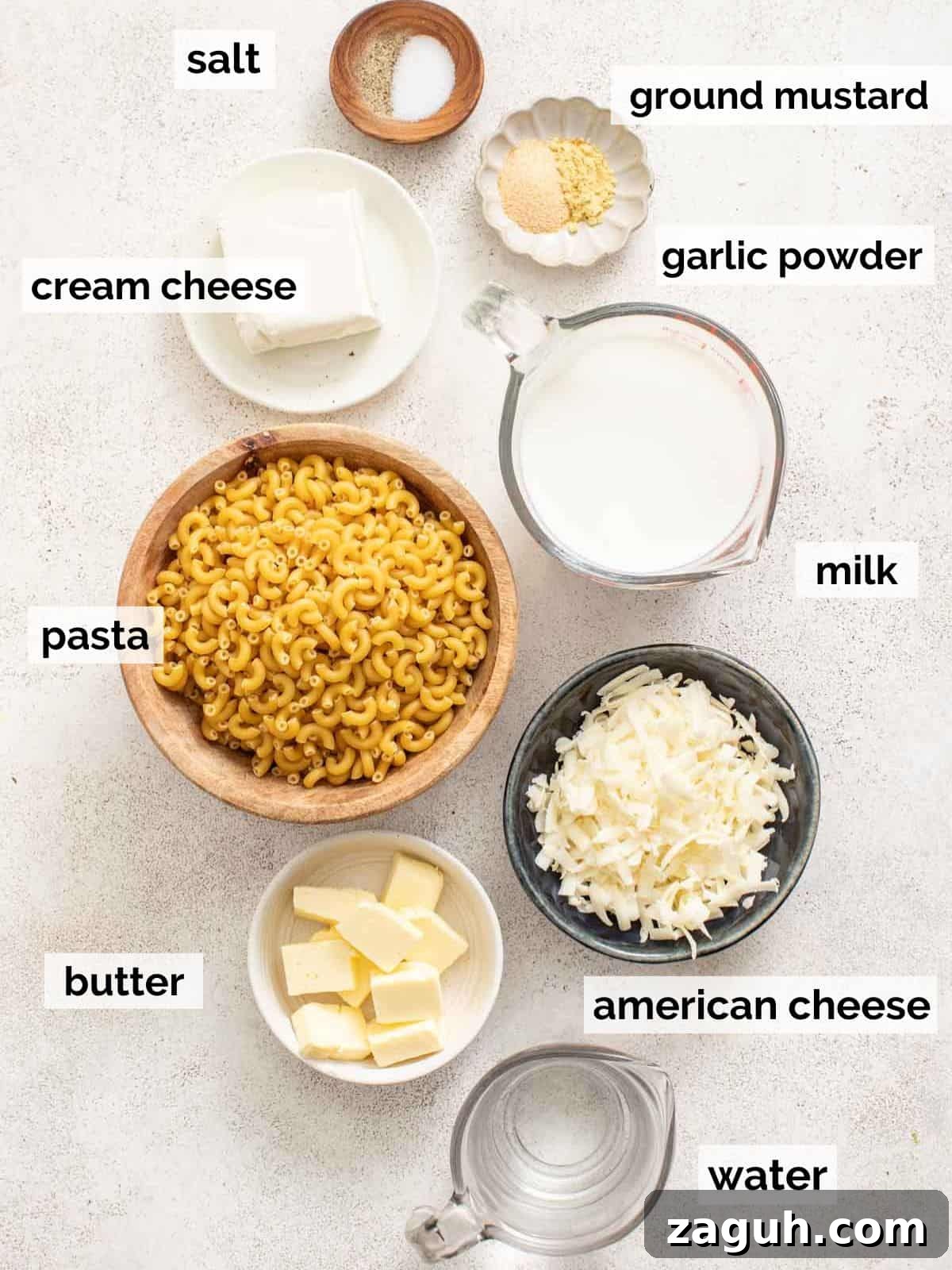 Creamy Slow Cooker Mac and Cheese with Cream Cheese 3 Ingredients for crockpot mac and cheese with cream cheese and american cheese on a white background.