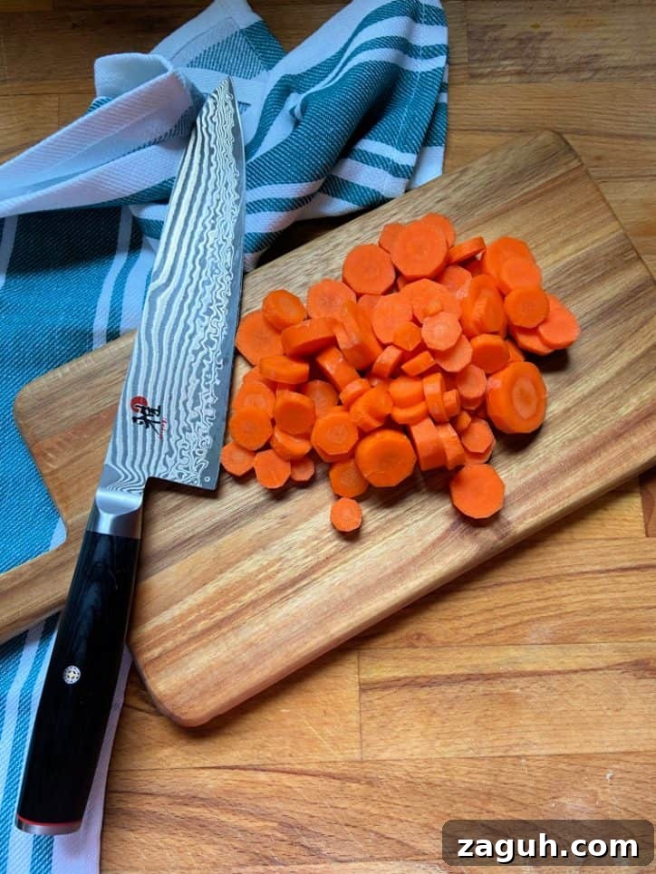 Tender Pressure-Cooked Carrots in 10 Minutes 4 sliced carrots on cutting board