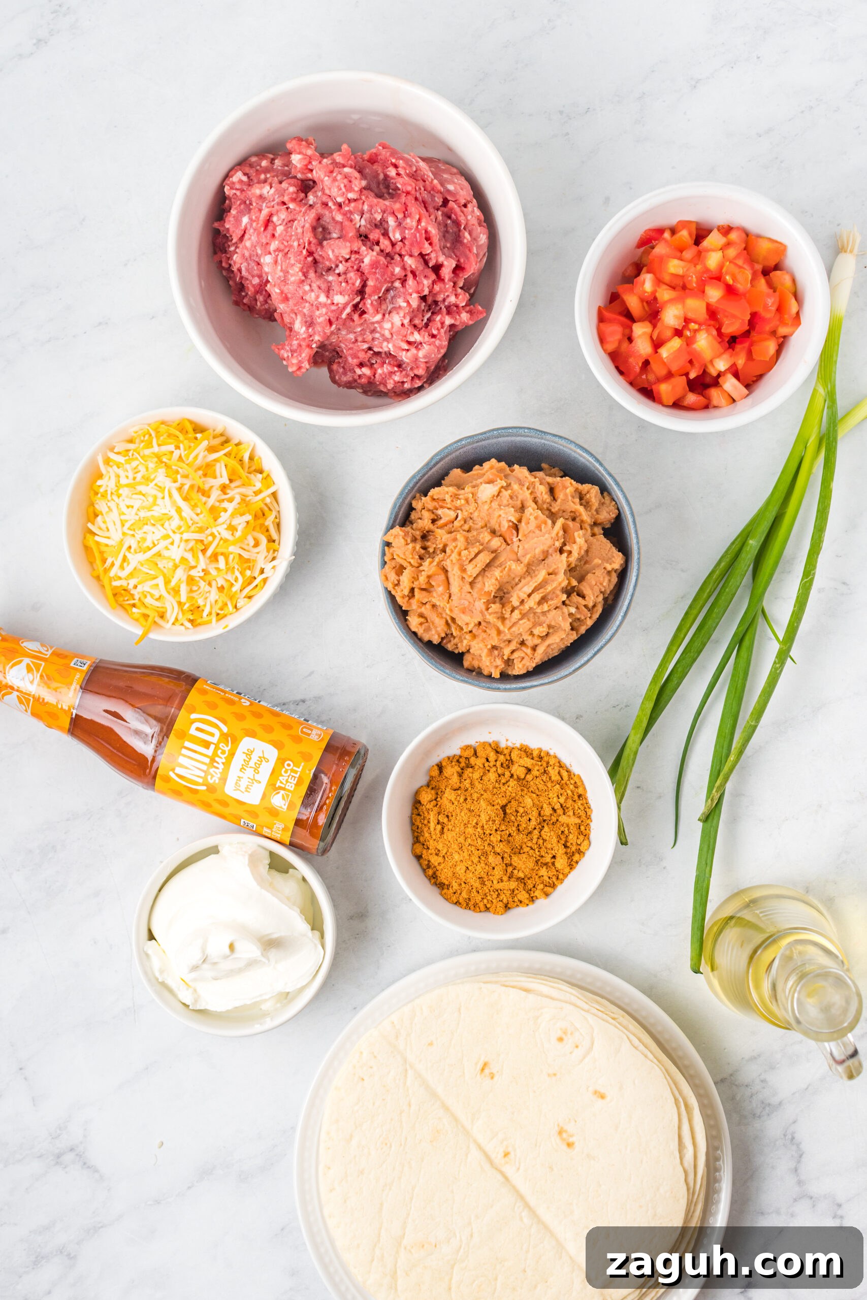 Taco Bell Mexican Pizza: How to Order, Ingredients & Nutrition Facts 6 Overhead shot of ingredients needed to make Taco Bell Mexican Pizza.