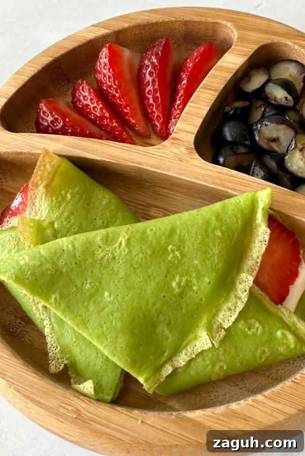 Spinach and Apple Baby Puffs: Nutritious Homemade Finger Food 11 Spinach crepes filled with yogurt and strawberries.