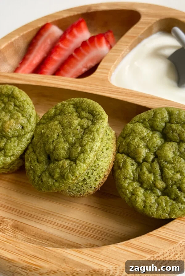 Spinach and Apple Baby Puffs: Nutritious Homemade Finger Food 8 Spinach banana muffins served with a side of strawberries and yogurt