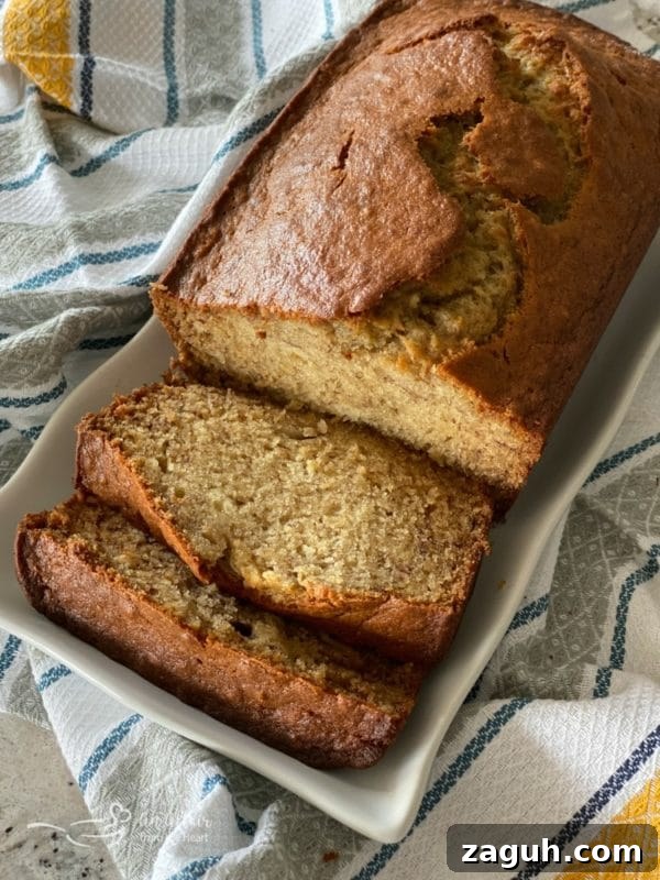 Chocolate Chip Applesauce Bread Recipe for Moist Loaves 3 overhead of The BEST Banana Bread on a white platter