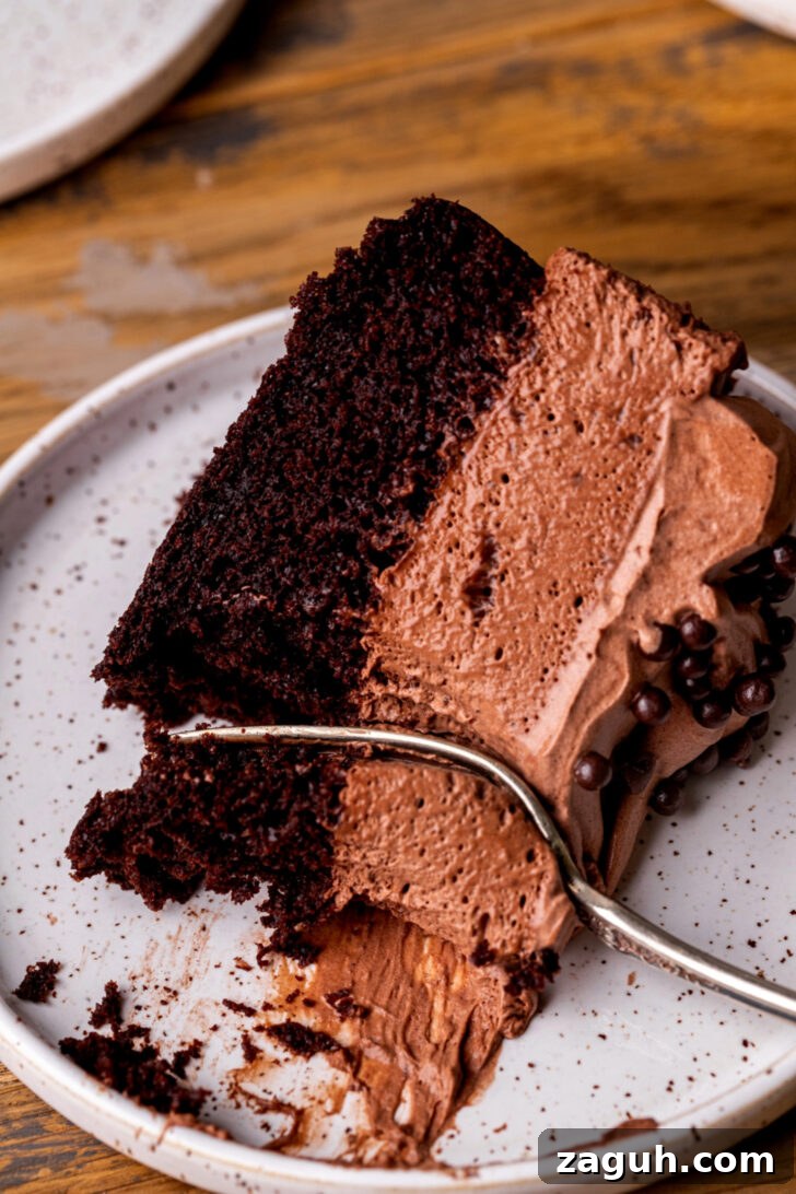 Decadent Chocolate Mousse Cake Recipe for Chocolate Lovers 12 Fork inserted into a slice of cake.