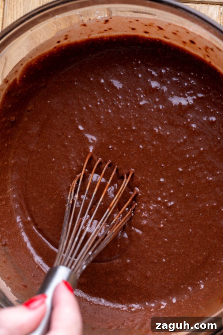 Decadent Chocolate Mousse Cake Recipe for Chocolate Lovers 4 Chocolate cake batter in a bowl.
