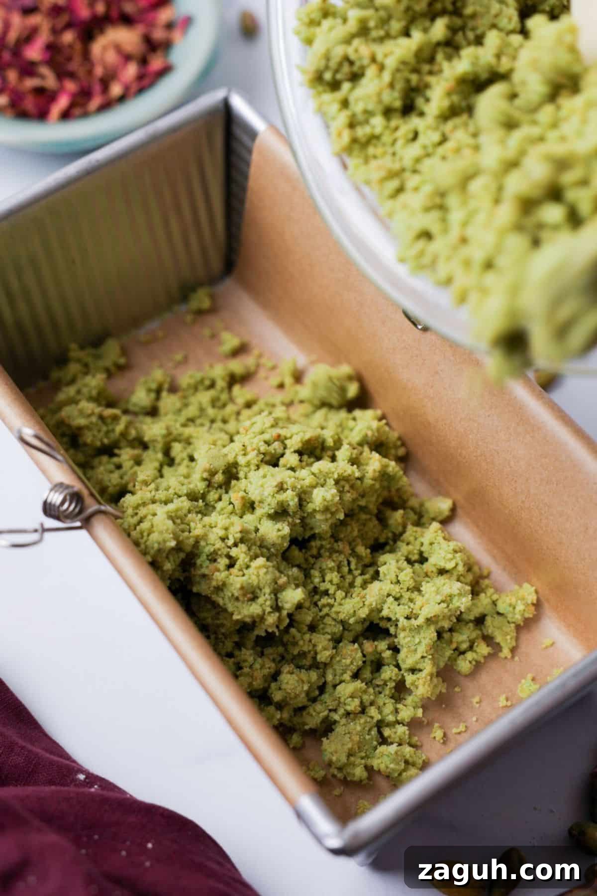Homemade Pistachio Protein Bars Recipe for High-Energy Snacks 6 Green pistachio dough pressed into parchment-lined loaf pan