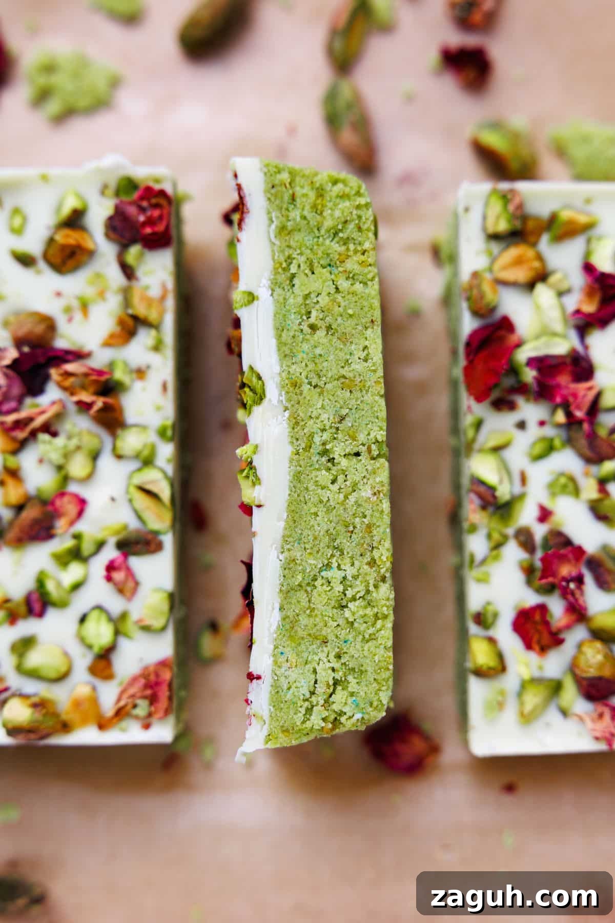 Homemade Pistachio Protein Bars Recipe for High-Energy Snacks 10 Single pistachio protein bar standing upright showing dense green pistachio layer beneath white chocolate coating