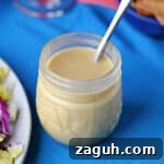 Zesty Honey-Lime Salad Dressing Recipe for Fresh Greens 11 A jar of honey lime dressing ready to use on a salad.