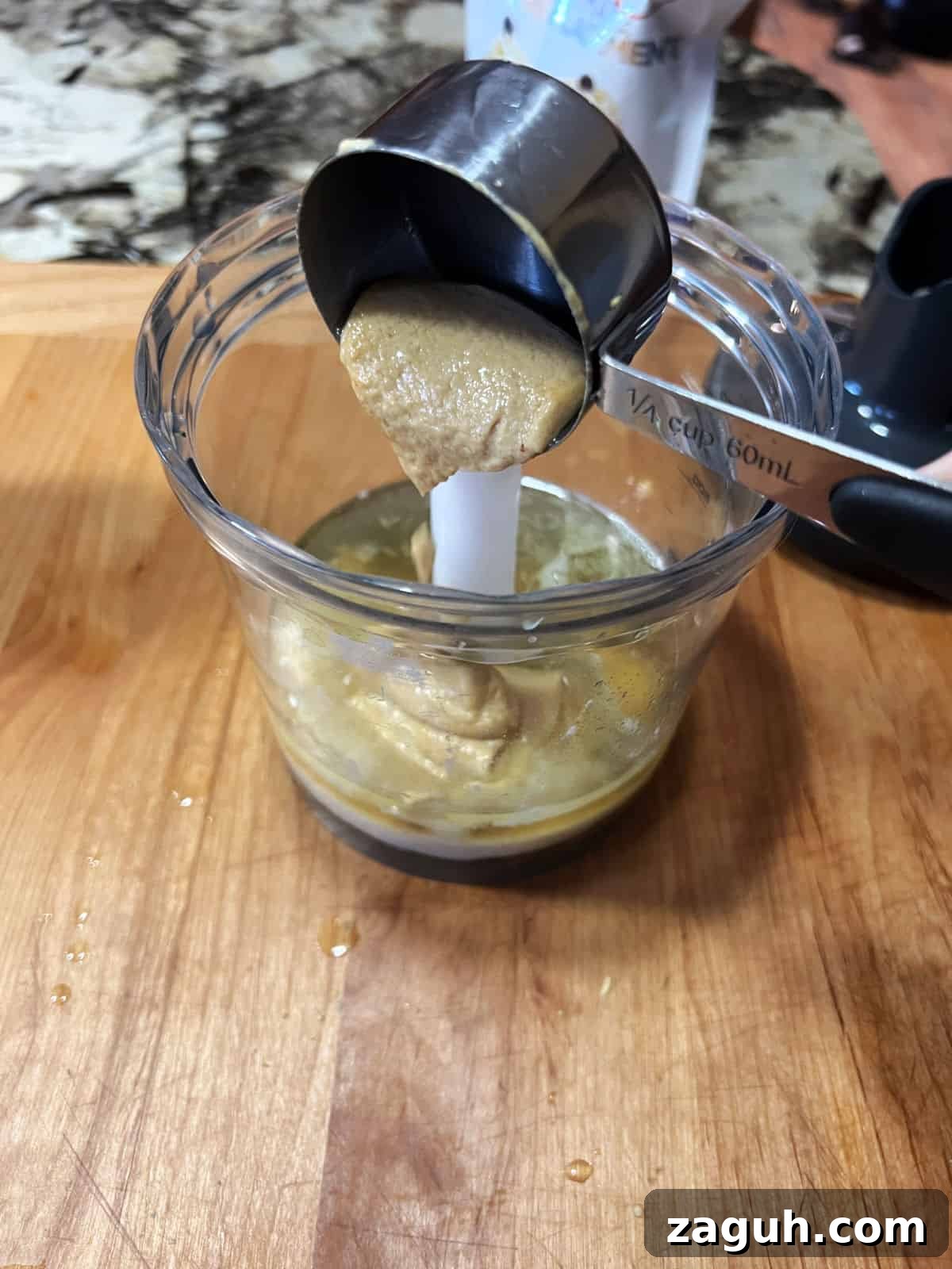 Zesty Honey-Lime Salad Dressing Recipe for Fresh Greens 5 Adding Dijon mustard to the blender container.