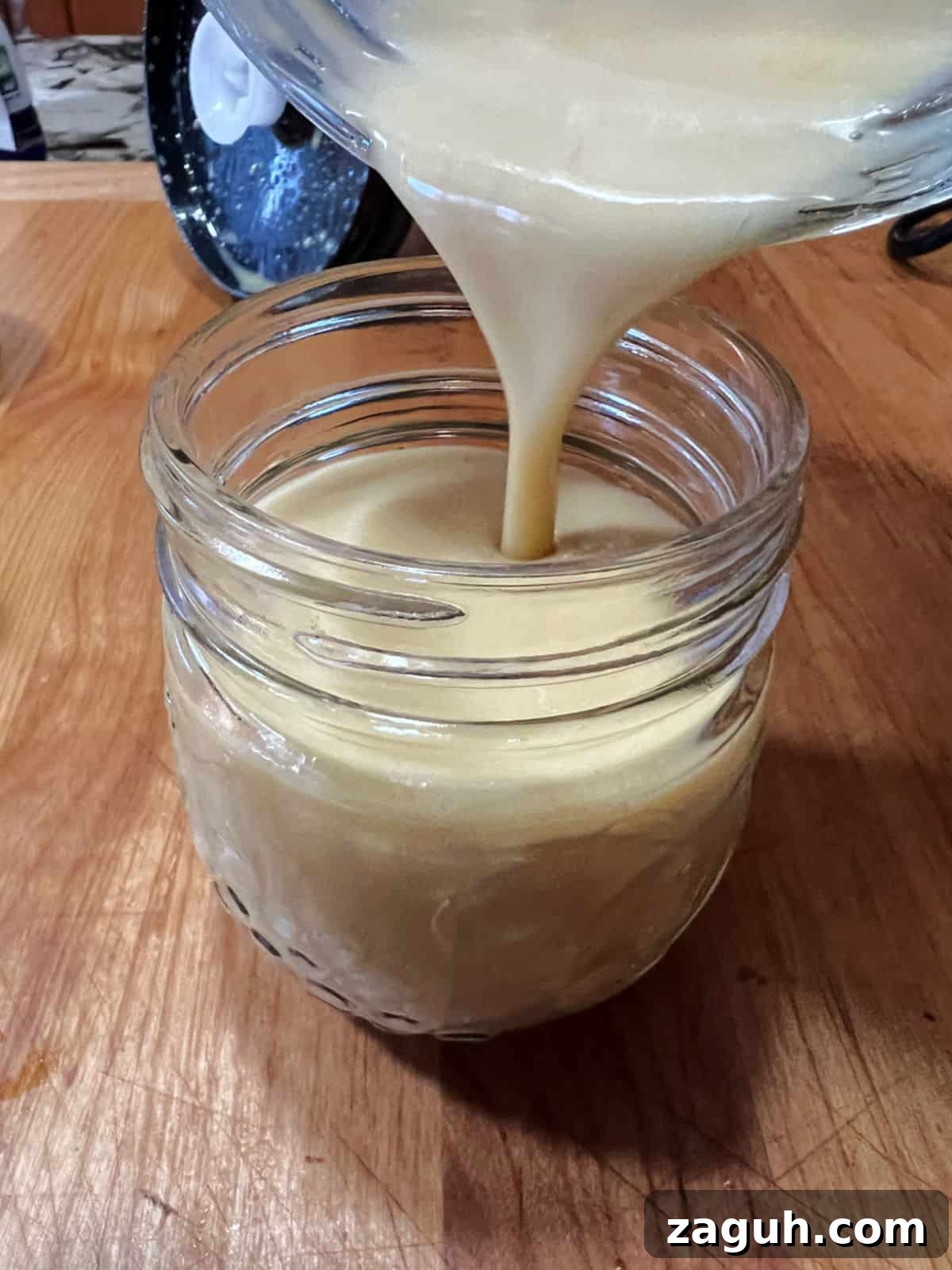 Zesty Honey-Lime Salad Dressing Recipe for Fresh Greens 7 Pouring dressing into a jar for storage.