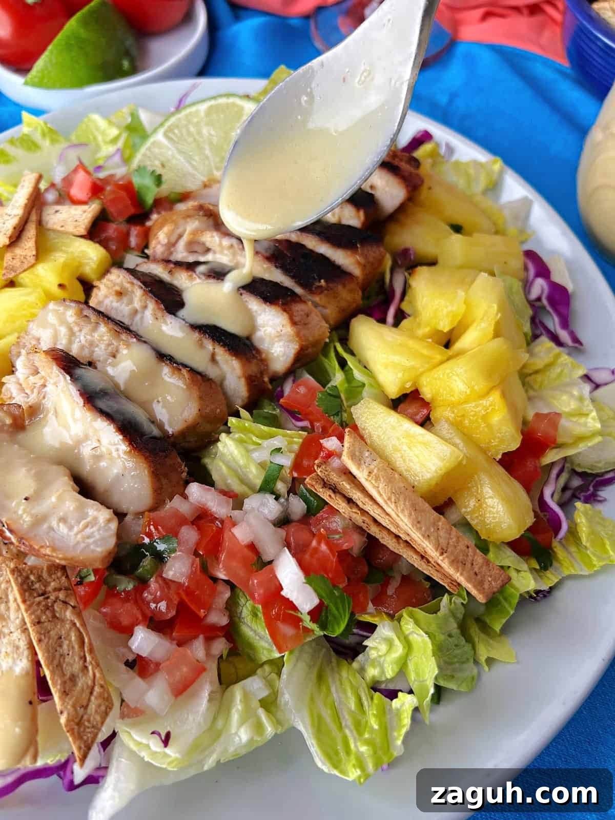 Zesty Honey-Lime Salad Dressing Recipe for Fresh Greens 8 Drizzling honey lime dressing on a grilled Caribbean chicken salad.