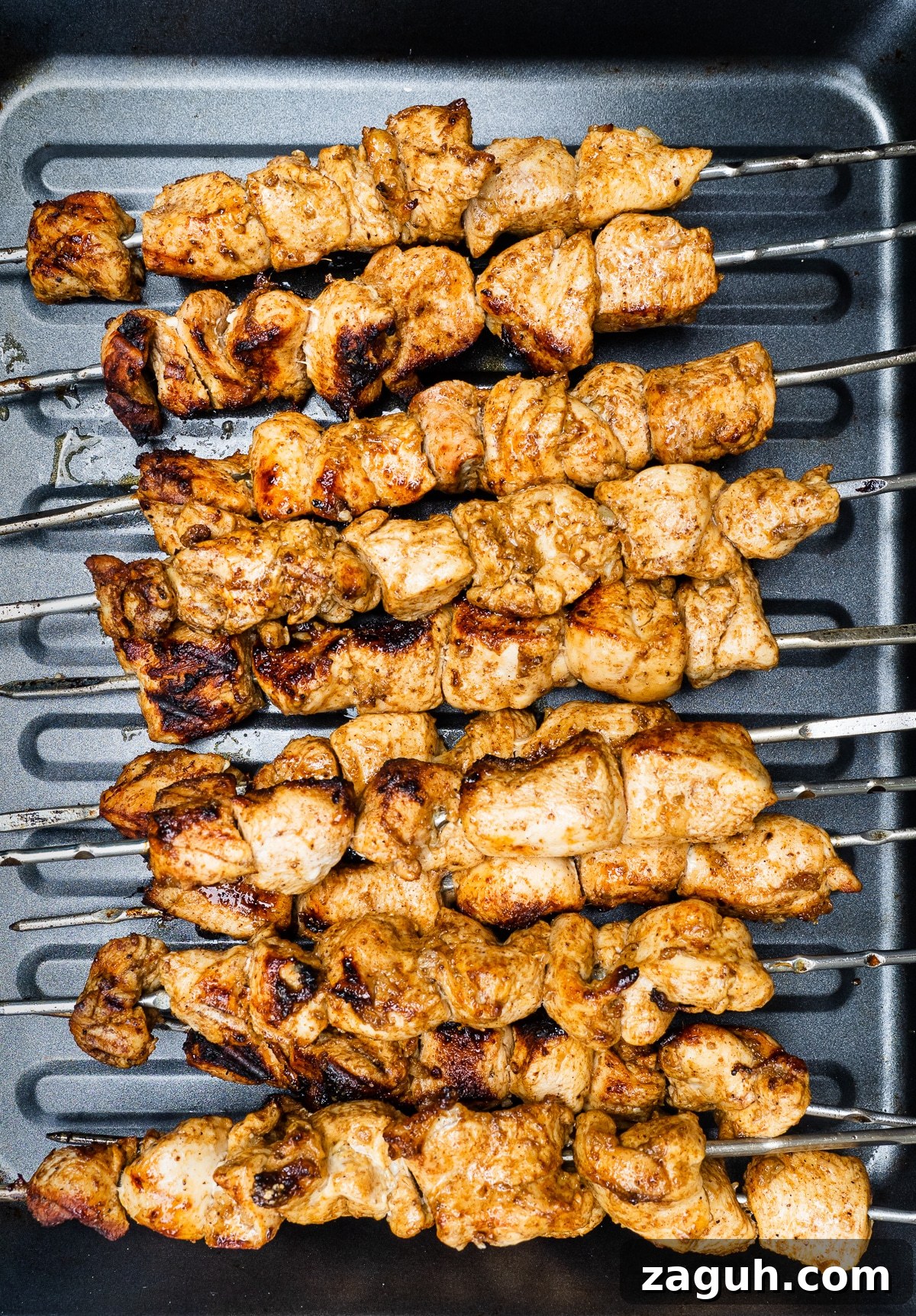 Chicken Shawarma Kebabs Recipe: Juicy Grilled Middle Eastern Skewers 2 Grilled chicken skewers.