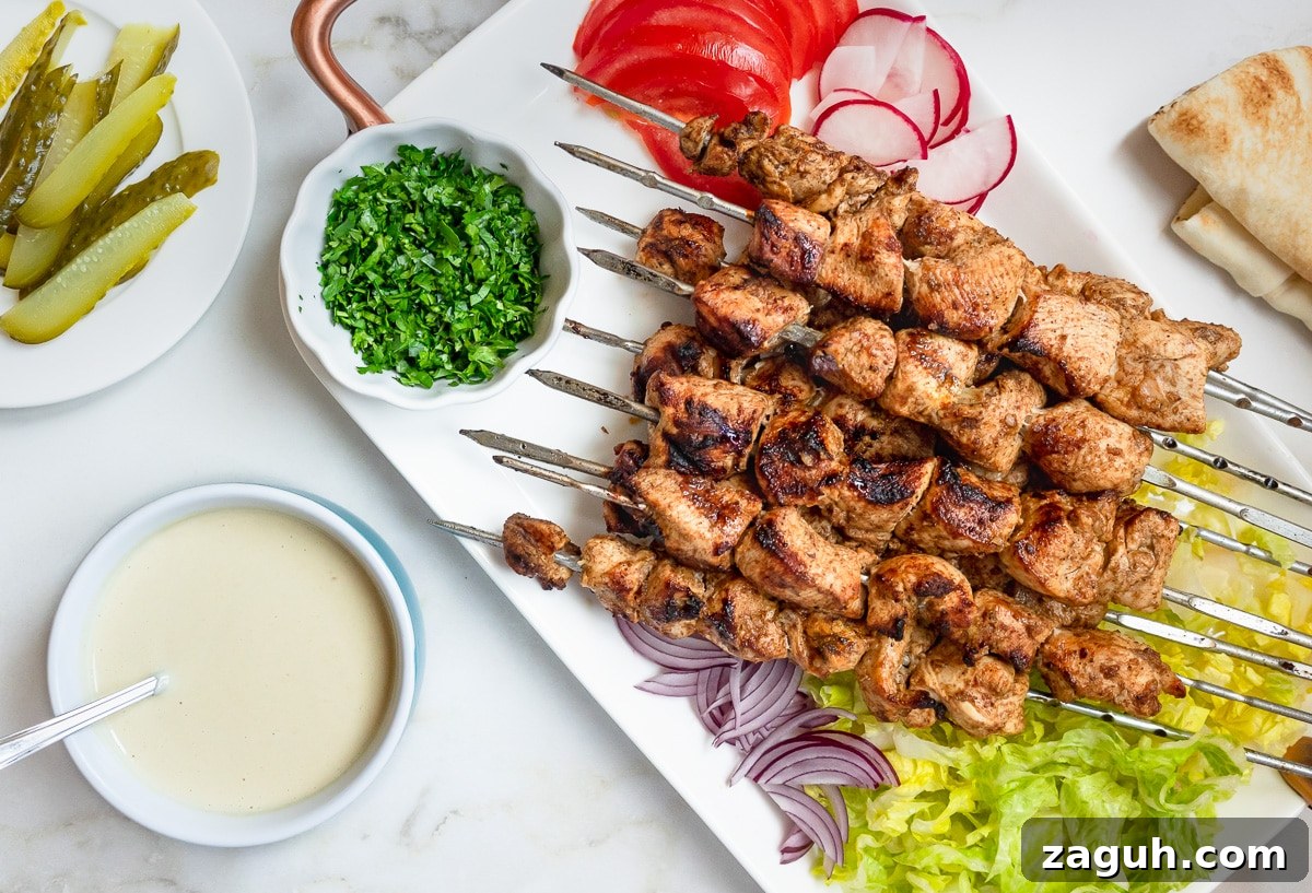 Chicken Shawarma Kebabs Recipe: Juicy Grilled Middle Eastern Skewers 6 Platter of chicken shawarma kebabs.