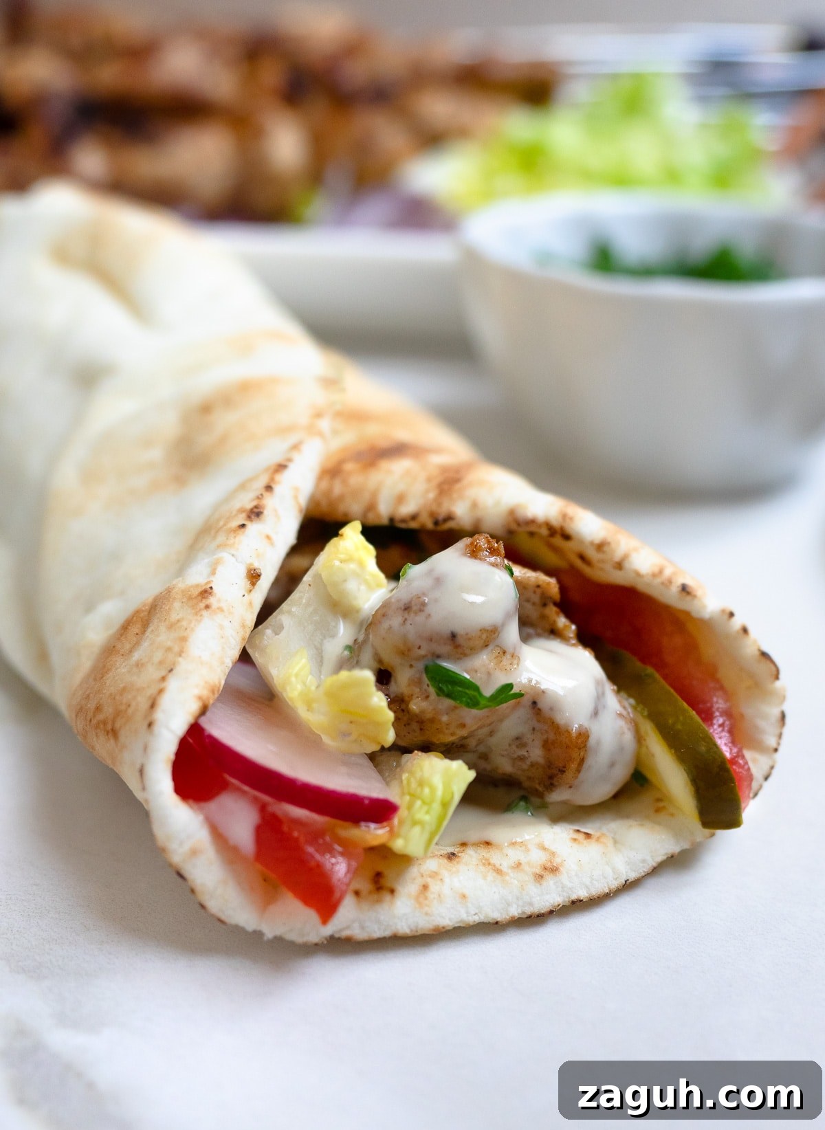 Chicken Shawarma Kebabs Recipe: Juicy Grilled Middle Eastern Skewers 7 Chicken shawarma kebab pita sandwich.