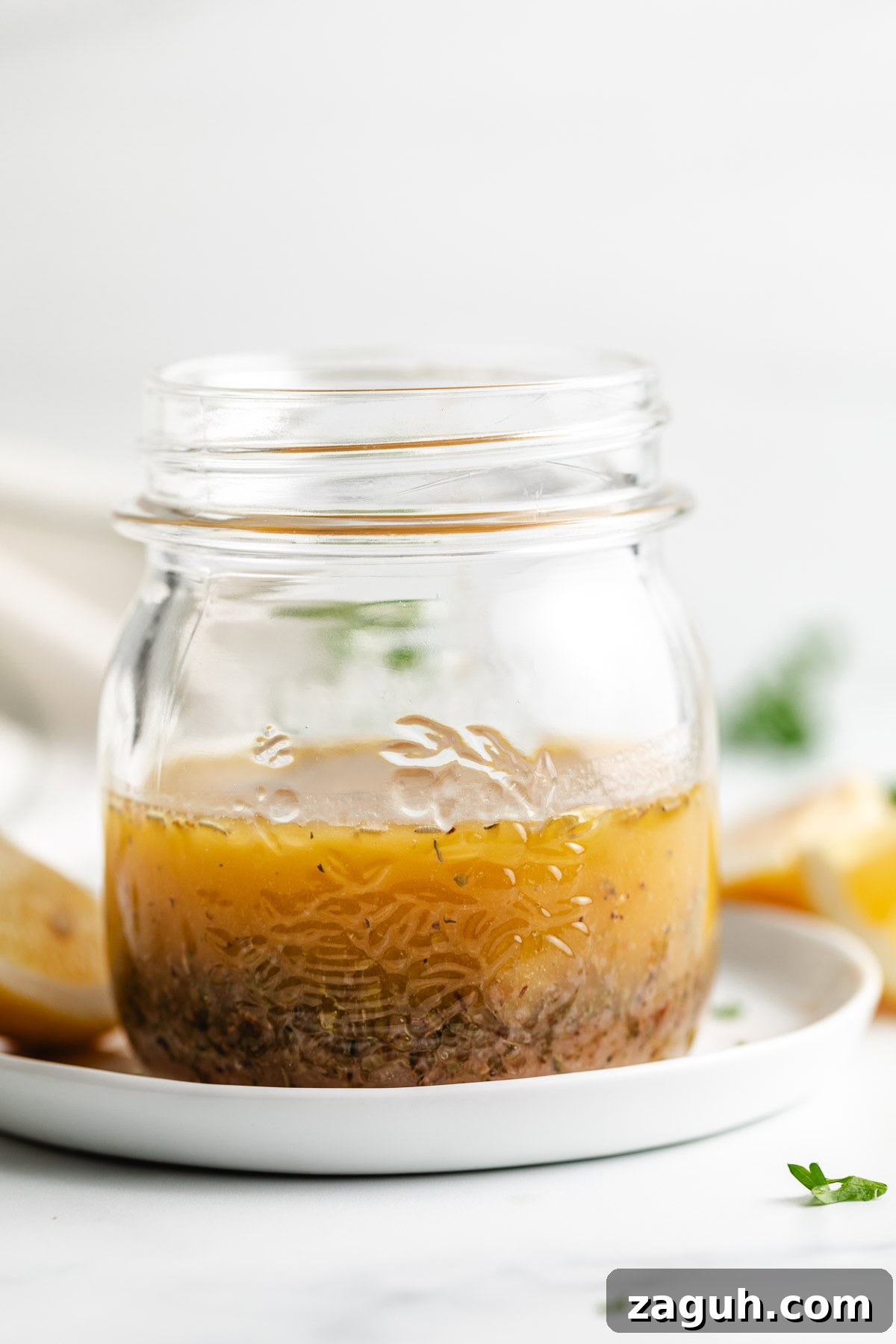 Authentic Italian Dressing Recipe for Fresh Flavor 3 Side view of dressing in a jar.